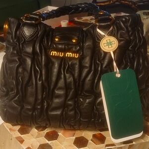 Coffee Convertible Tote bag soft Calf by Miu Miu. With it's dust bag.